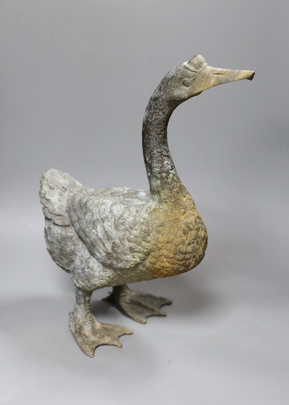 A weathered bronze garden fountain modelled as a goose, 46cm